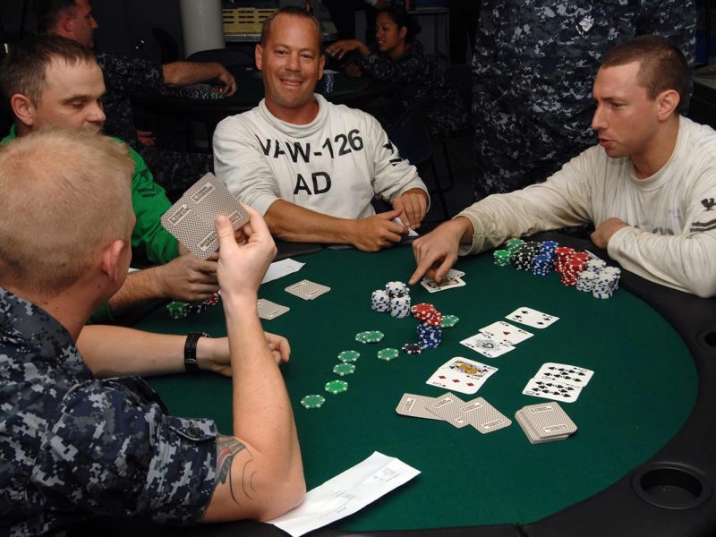 US Navy 090620 N 2798F 033 Sailors assigned to the aircraft carrier USS Harry S. Truman CVN 75 and Carrier Air Wing CVW 3 compete in a Texas Hold Em Poker tournament aboard Harry S. Truman